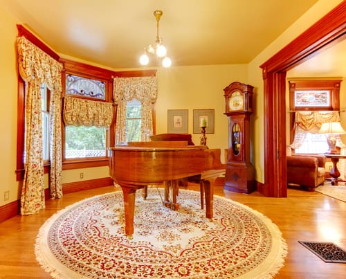 Circular rugs make great additions in a home at areas with bay windows.