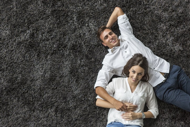 Two people on rug
